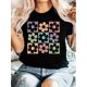 thumbnail image 1 of Retro-Inspired Women's Floral Print T-Shirt - Casual Short Sleeve, Round Neck, 100% Polyester, Machine Washable, in Black with Pink & Green Geometric Print Patterns, Short Sleeve, T-shirt, 1 of 6