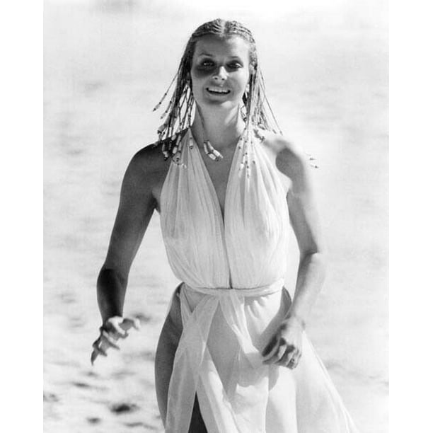 Bo Derek with braids in white dress running on beach 10 24x36 inch