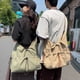 thumbnail image 2 of Nuevo bolso de mensajero con cordón japonés para jóvenes, bolso de hombro de gran capacidad para ocio para hombres y mujeres, mochila ligera para desplazamientos diarios, 2 of 5