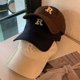 thumbnail image 2 of Una cara de bordado de letras pequeña todo con una gorra para tapar el calor., 2 of 5