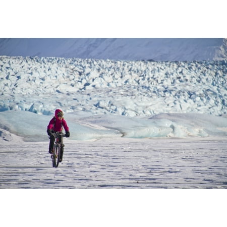 Woman Fat Tire Mountain Biking On The Knik Glacier Chugach Mountains Southcentral Alaska Winter