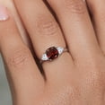 thumbnail image 5 of Gem Stone King 10K White Gold Red Garnet and White Created Sapphire 3-Stone Engagement Ring for Women (2.49 Cttw, 7MM Cushion and 4MM Trillion, Size 6), 5 of 6