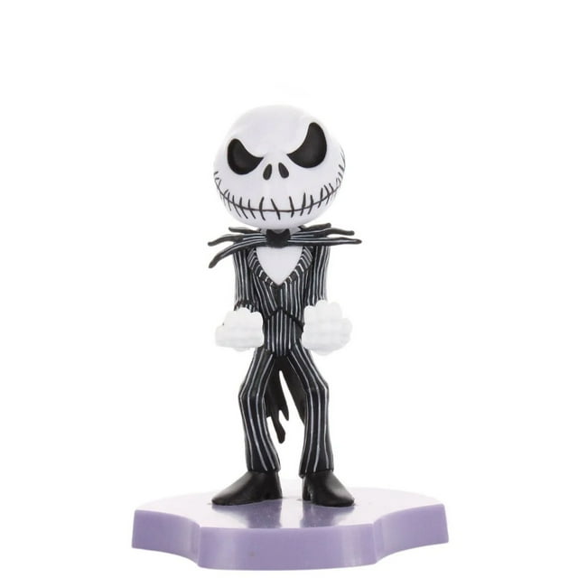 Exquisite Gaming The Nightmare Before Christmas: Jack Skellington Holdem, Mini Phone Stand and Device Holder showing a 4-inch tall Jack Skellington figure in a black and white pinstripe suit with bat-shaped bow tie, standing on a purple base with hands designed to hold a phone or earbuds, suitable for organizing small tech gadgets.