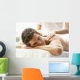 thumbnail image 1 of Young Man Enjoying Massage Wall Mural by Wallmonkeys Peel and Stick Graphic (24 in W x 16 in H) WM213266, 1 of 4