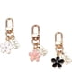 thumbnail image 1 of Juego de 3 llaveros de flores para mujer, pequeños, blancos, negros, rosas, con margaritas, bonitos accesorios para llavero de coche para niña, 1 of 4