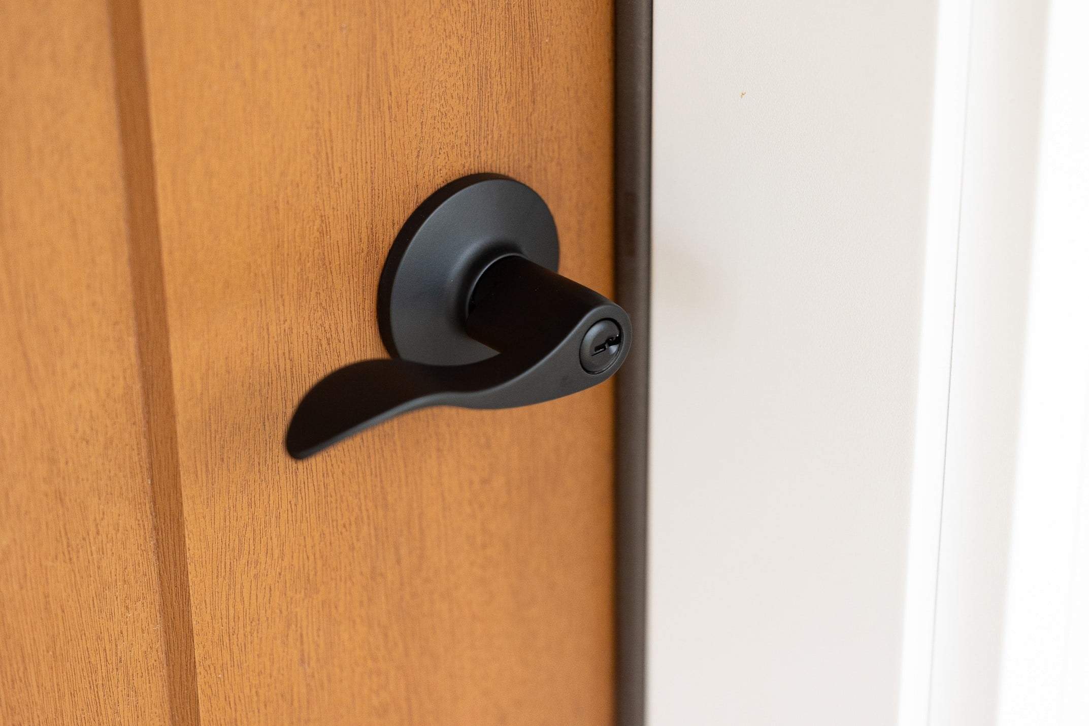Brinks Keyed Entry Modern Wave Style Lever Doorknob with Pro-Guard