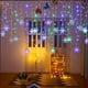 thumbnail image 1 of Cortina de luces LED con forma de copo de nieve, tira de luces de hielo para decoración de exteriores, cadena de luces de cono de hielo, cadena de luces de mariposa, luces para vestidos navideños, 1 of 5