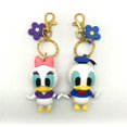 thumbnail image 4 of Llavero colgante de Disney para niños, colgante de Mickey Mouse, Pato Donald, bolsa de regalo pequeña, llavero de flores, recuerdos de eventos, 4 of 5