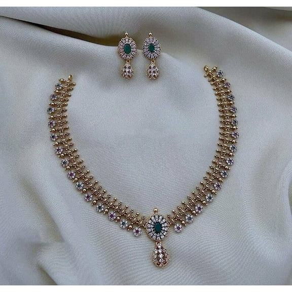 South Indian Bollywood Gold-Plated Short Necklace Set – Matte Finish Brass with Emerald, White Kemp Stones, AD CZ Jewelry Matching Floral Earrings