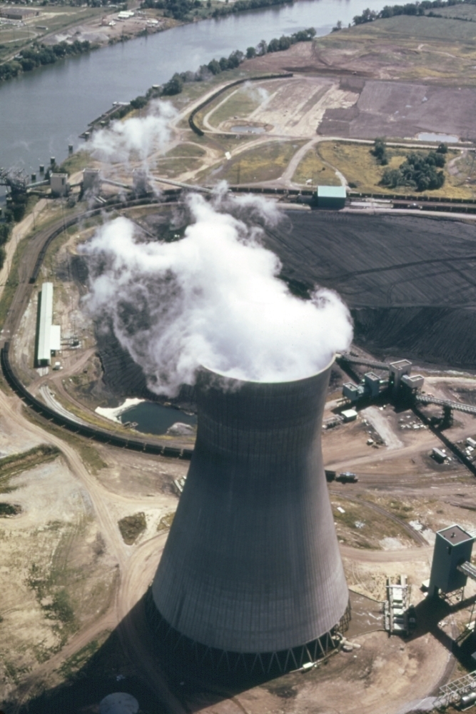 Steam Rises From One Of The Massive Cooling Towers Of The John Amos