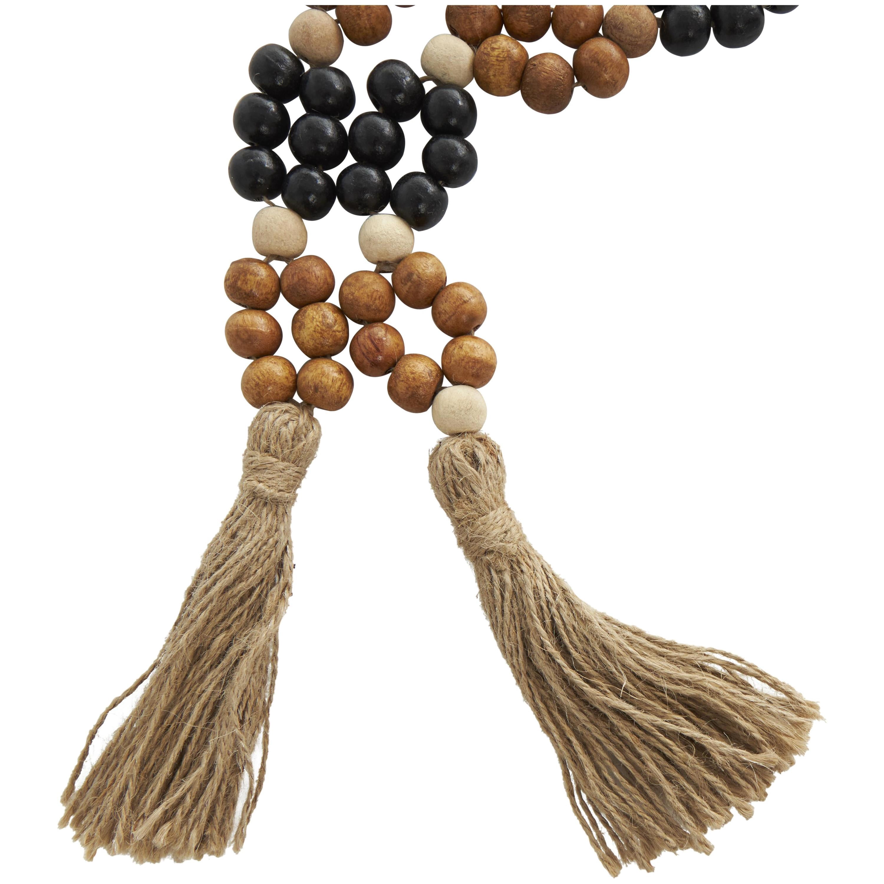 DecMode Handmade Round Double Layered Long Carved Brown Mango Wood Garland with Tassel with Black and Cream Accents
