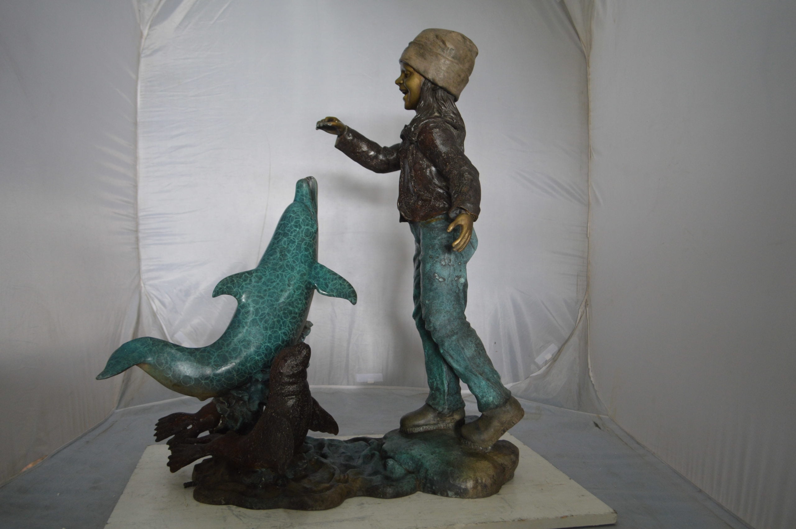 Nifao Girl feeding a dolphin and seals – Outdoor Bronze Fountain, Garden Water Feature, 28"L x 17"W x 37"H
