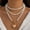 Golden, variant on NICKSUN Pearl Beaded Heart Layered Pendant Necklace for Women,14k Gold Plated Punk Stacked Pearl Choker Necklace,Charm Statement Celebration Gift