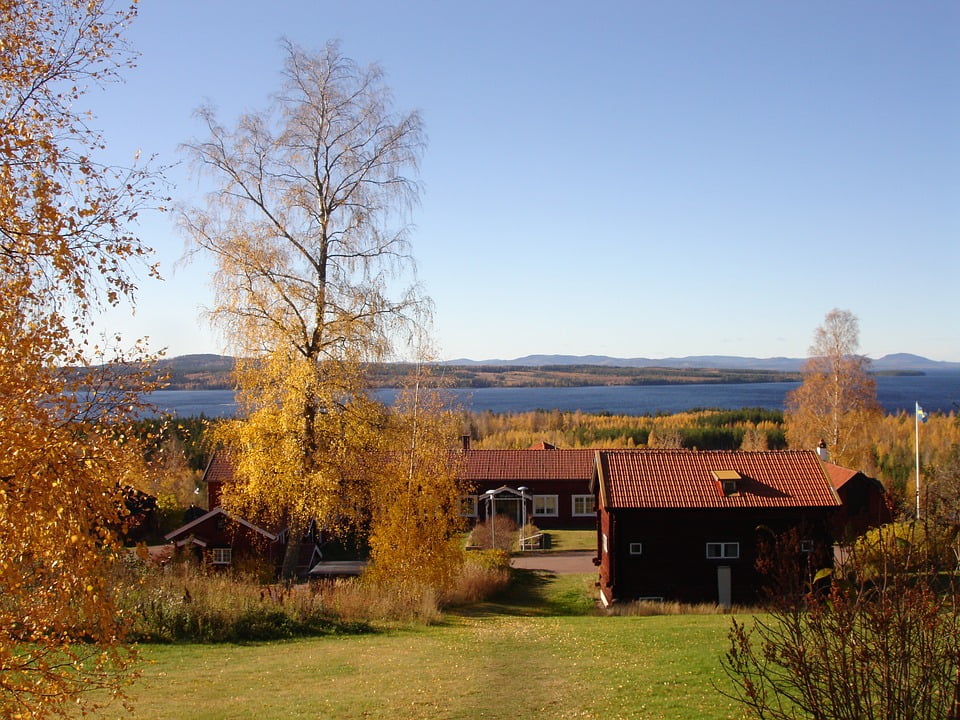 Red house reflection, as seen on a stretch of road between Söderhamn and Gävle o