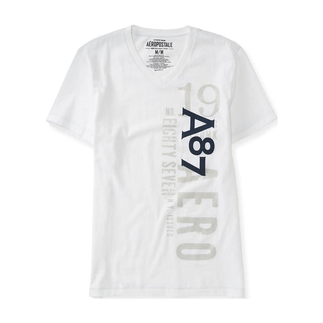 camiseta gráfica aeropostale con cuello en v vert para hombre blanca extra pequeña, camiseta blanca 100% algodón de manga corta con escote en V y gráfico vertical en el costado derecho con números y letras en gris claro y 'A87' en azul oscuro, etiqueta Aeropostale visible en el cuello y corte recto casual; también suele usarse como camiseta ligera para capas de verano.