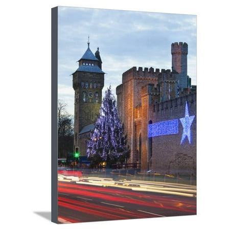 South Cave Castle Christmas Cardiff Castle with Christmas Lights and Traffic Light Trails, Cardiff, South Wales, Wales, United Stretched Canvas Print Wall Art By Billy Stock ()