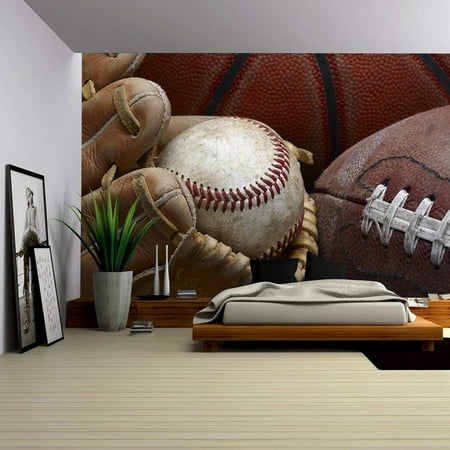 wall26 - Close Up Shot of Well Worn Baseball in Baseball Glove, Football and Basketball - Removable Wall Mural | Self-adhesive Large Wallpaper - 66x96