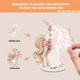thumbnail image 3 of A rotating acrylic display showcasing a beautifully detailed unicorn with flowing pink bows and a realistic wood grain finish, 3 of 8