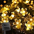 thumbnail image 1 of Guirnalda de luces solares con forma de flor de cerezo, 50 LED, 8 modos, impermeable, para exteriores, decoración navideña para jardín, patio e interior, blanco cálido [Clase energética A+++], 1 of 4