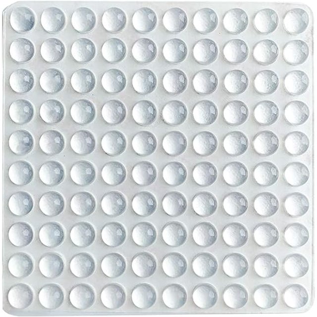 topes de goma protectores de 1 pieza, como muestra la imagen hoja con múltiples topes adhesivos transparentes hemisféricos 5 x 2 mm en filas, vista cenital sobre fondo blanco, para amortiguadores de muebles, reducción de ruido y antivibración, adecuados para puertas, cajones y respaldos de sillas.