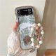thumbnail image 1 of Funda con diseño de flores para Z Flip 5, con marco de ondas rizadas, compatible con Samsung Galaxy Z Flip 5, con pulsera para niñas y mujeres, color marrón, 1 of 1