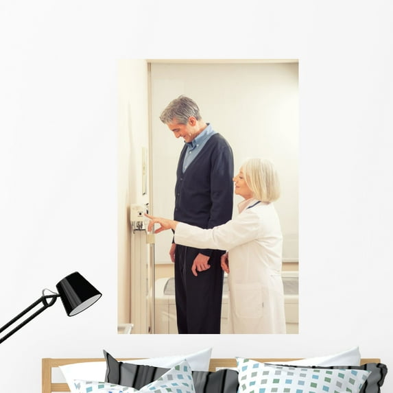 General Practitioner Measuring Male Wall Mural by Wallmonkeys Peel and Stick Graphic (48 in H x 32 in W) WM53536