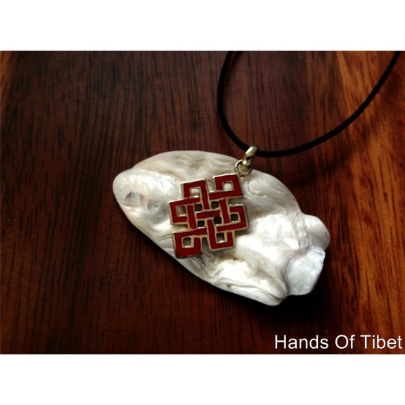 Hand Crafted Eternal Knot Coral and Brass Pendant