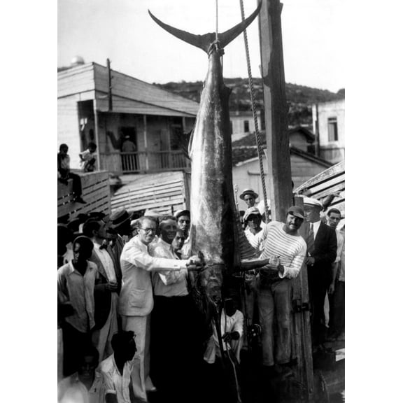 Ernest Hemingway With A Record Breaking Black-Marlin Caught On A Recent Fishing Trip Off The Cuban Coast Ca.