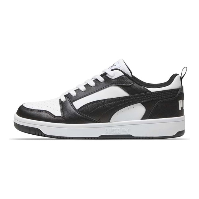 tenis puma rbd low blanco negro 38637327 blanco 25.5 Vista lateral derecha de tenis PUMA RBD Low blanco con superposiciones negras; empeine con puntera perforada, franja PUMA en costados y centro, logotipo PUMA Cat en lengüeta y talón, plantilla SoftFoam+ y mediasuela y suela de goma. También suelen usarse para look urbano casual.
