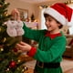 thumbnail image 4 of Adornos Navideños de Peluche con Forma de Mini Botas y Lazo para El Árbol | Adorables Decoraciones Navideñas | Material Plástico Resistente | Paquete de 10, 4 of 6