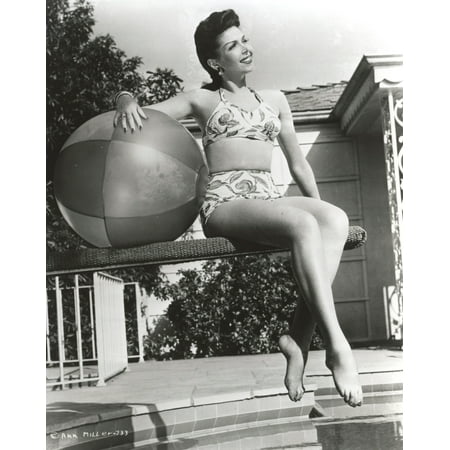 Photo Holding Ball - Ann Miller sitting on the Jumping Board Holding a Ball in a Classic Portrait Photo Print