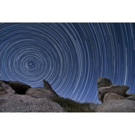 - A boulder outcropping and star trails in the high desert of Anza Borrego Desert State Park California Poster Print