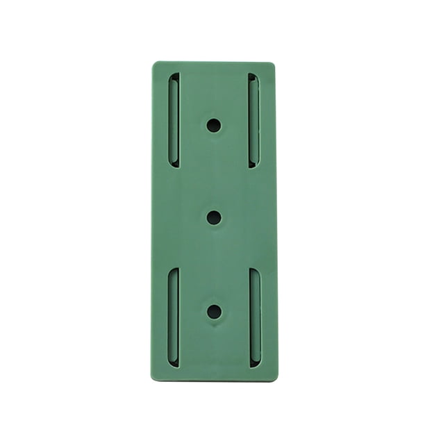 Retenedor de enchufe Montado en la pared Punch Free Home Toma de corriente Fixer Holder Green