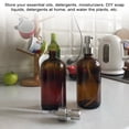 thumbnail image 3 of Paquete de 2 botellas dispensadoras gruesas de color ámbar con acero inoxidable plateado TFixol Natural, 3 of 7