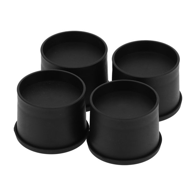 Herwey Adjustable Table Leg Furniture Legs Mini Round Furniture Feet Mat Multifunctional Non‑Slip Risers Lifts Height Floor. Set of four black plastic and rubber furniture risers designed to fit furniture legs with a diameter of approximately 7.5 cm. These risers add 6.5 cm in height, provide non-slip support, and include double-sided tape for secure placement. Ideal for creating additional storage space and easier cleaning under furniture.