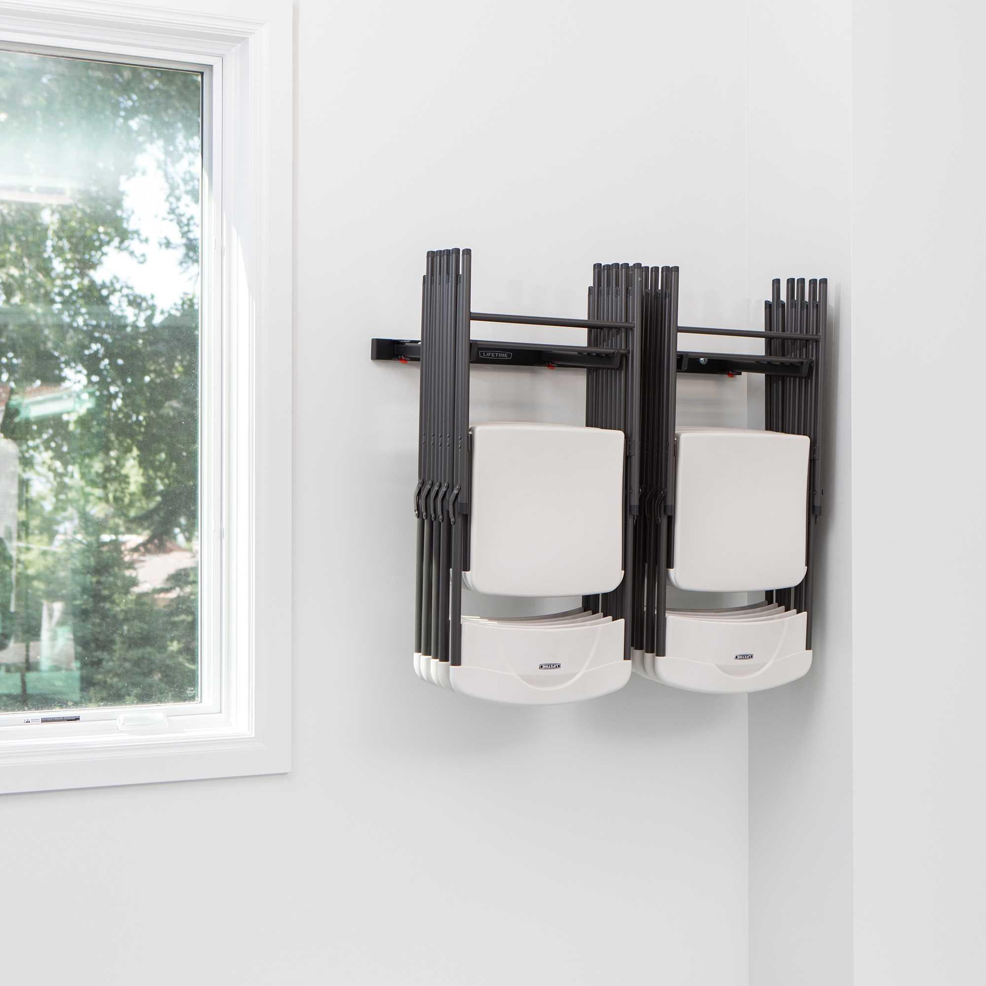 Hanging folding chairs on wall 2025
