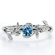 thumbnail image 1 of JeenMata Anillo de Compromiso Solitario con Diseño de Hojas y Topacio Azul Claro Redondo de 0,50 Quilates Chapado en Oro Blanco de 18 K sobre Plata, 1 of 6
