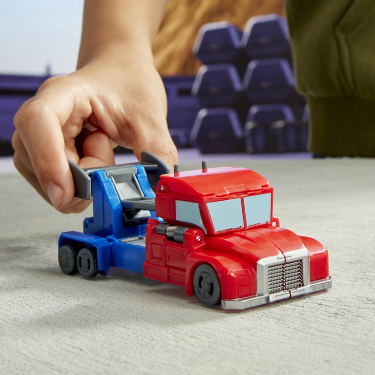 Transformers EarthSpark Action Figure Optimus Prime 10 Cm - Conversione In 1 Passaggio Con Lancio