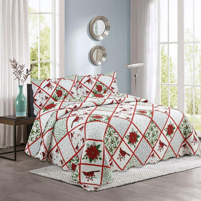 Christmas quilt set featuring embossed coverlet bedspread and matching shams with red cardinal, poinsettia, and green foliage pattern on white fabric