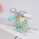 thumbnail image 2 of Llavero de letras con borlas verdes | Colgante de cristal acrílico | Lámina de oro, pegamento en gota, joyería de piedra engrosada | Amuleto de bolso con estilo, accesorio para mochila | 1 pieza, 2 of 2