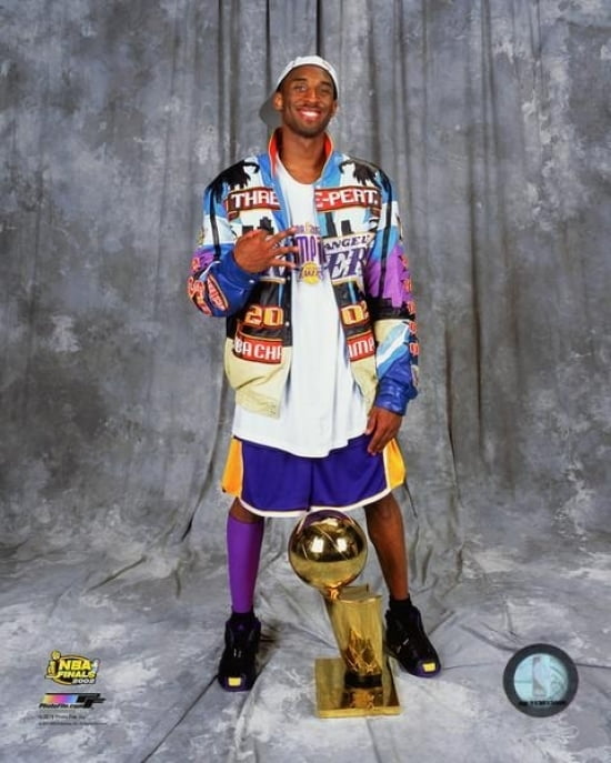 Kobe Bryant with the NBA Championship Trophy after winning Game 4 of the 2002 NBA Finals Photo