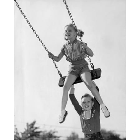 Boy Pushing His Sister On A Swing Poster Print