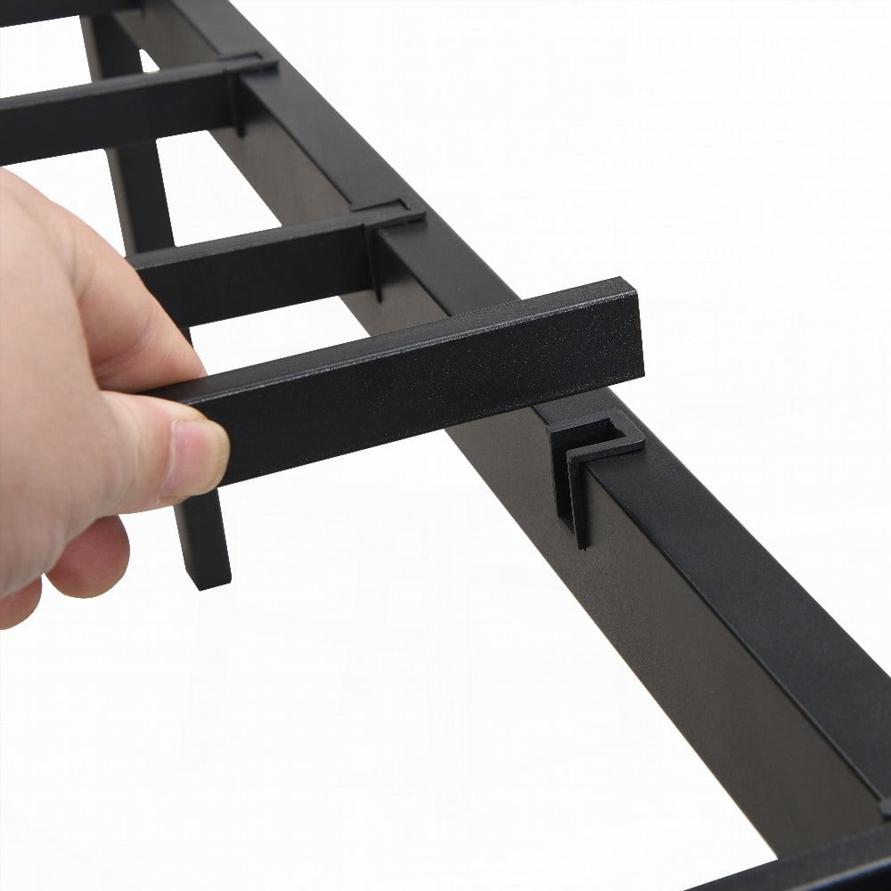 The black King Size metal bedframe with wood panel headboard provides under-bed storage and is easy to assemble. No box spring required.