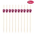 thumbnail image 1 of Estante de vino decorativo Pedty, 50 palitos de bambú para fruta, decoración para cóctel, 50 tenedores desechables de bambú para fruta con forma de calavera, color rosa y rojo., 1 of 8