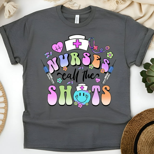 Nurses Call The Shots T-Shirt | Funny Nurse Graphic Tee with Syringe Design, Dark Heather, Size M