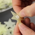 thumbnail image 3 of 100 Uds. Estrellas 3D que brillan en la oscuridad pegatinas de pared luminosas para la decoración del hogar de la sala de estar de la habitación de los niños Xemadio HMHZ312-1, 3 of 5