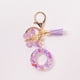 thumbnail image 1 of Xihbxyly Llavero de Resina Morada con Inicial Personalizada, Elegante Borla para Bolso, Cartera o Coche, Regalo Perfecto para Mujer, Cumpleaños, San Valentín o Pascua, 10 X 3,8 Cm., 1 of 4