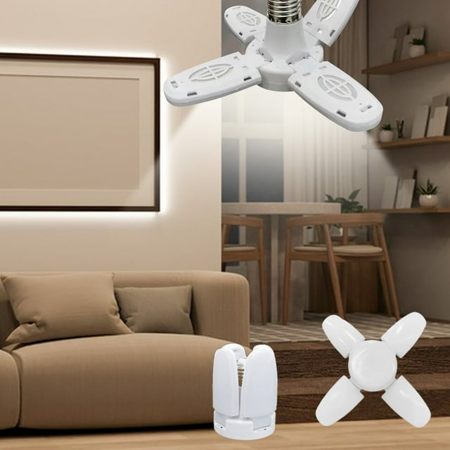 Vaidha High Brightness LED Leaf Light with a folding quadruple leaf design for adjustable lighting angles, 28W power, and E27 threaded port. This energy-efficient lamp emits a 6500K cool white light, ideal for offices or study areas. Made of durable ABS material, it is shown in a modern living room with a beige sofa and wooden furniture.