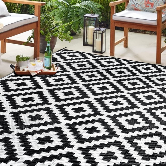 Alfombra reversible SAND MINE para exteriores, 6 x 9 pies, color blanco y negro