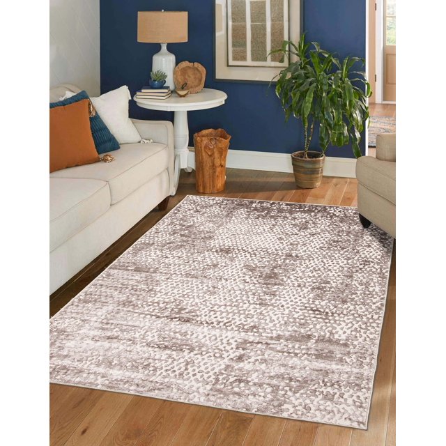 ECARPET Sarah contemporary area rug with abstract textured design in beige and brown tones on hardwood floor between sofas, complementing modern living room decor.
